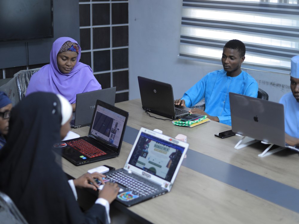 Software and Website Development — students building on laptops